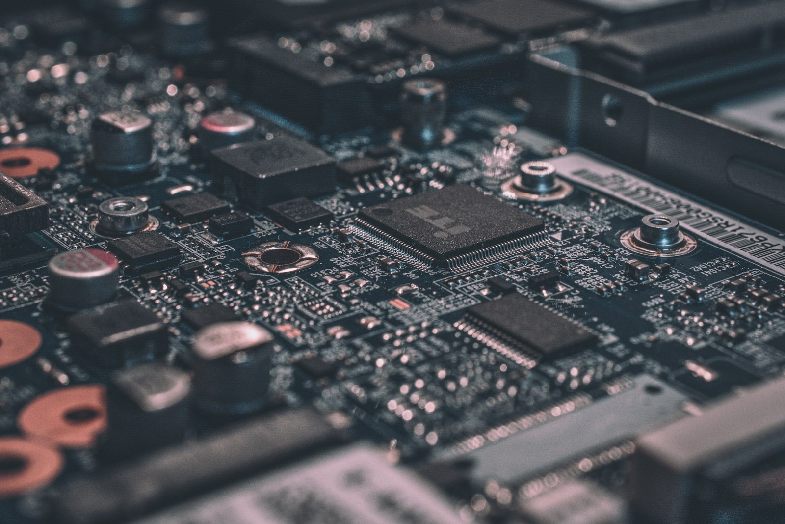 Macro view of computer hardware internals, the CPUs, memory, and boards behind the resale-whole versus sell-for-parts routing decision.
